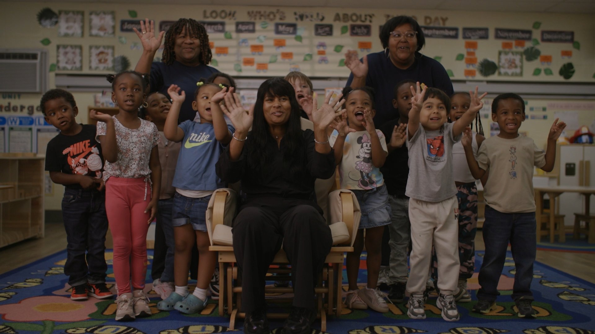 Children waving in the closing shot of the Wake County Smart Start 30th anniversary film